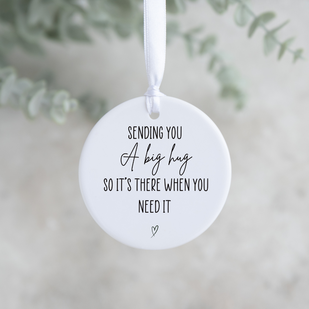 Close-up of ceramic keepsake with big hug message inside The Hug Box